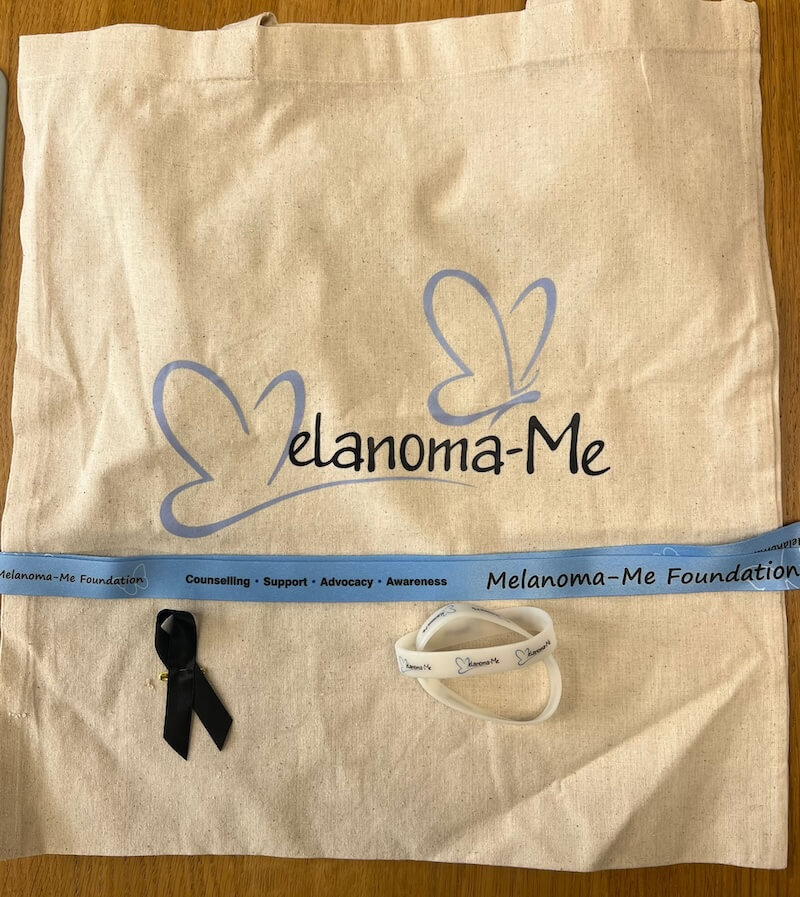 Tote bag, lanyard, black ribbon pin and UV detection wristband
